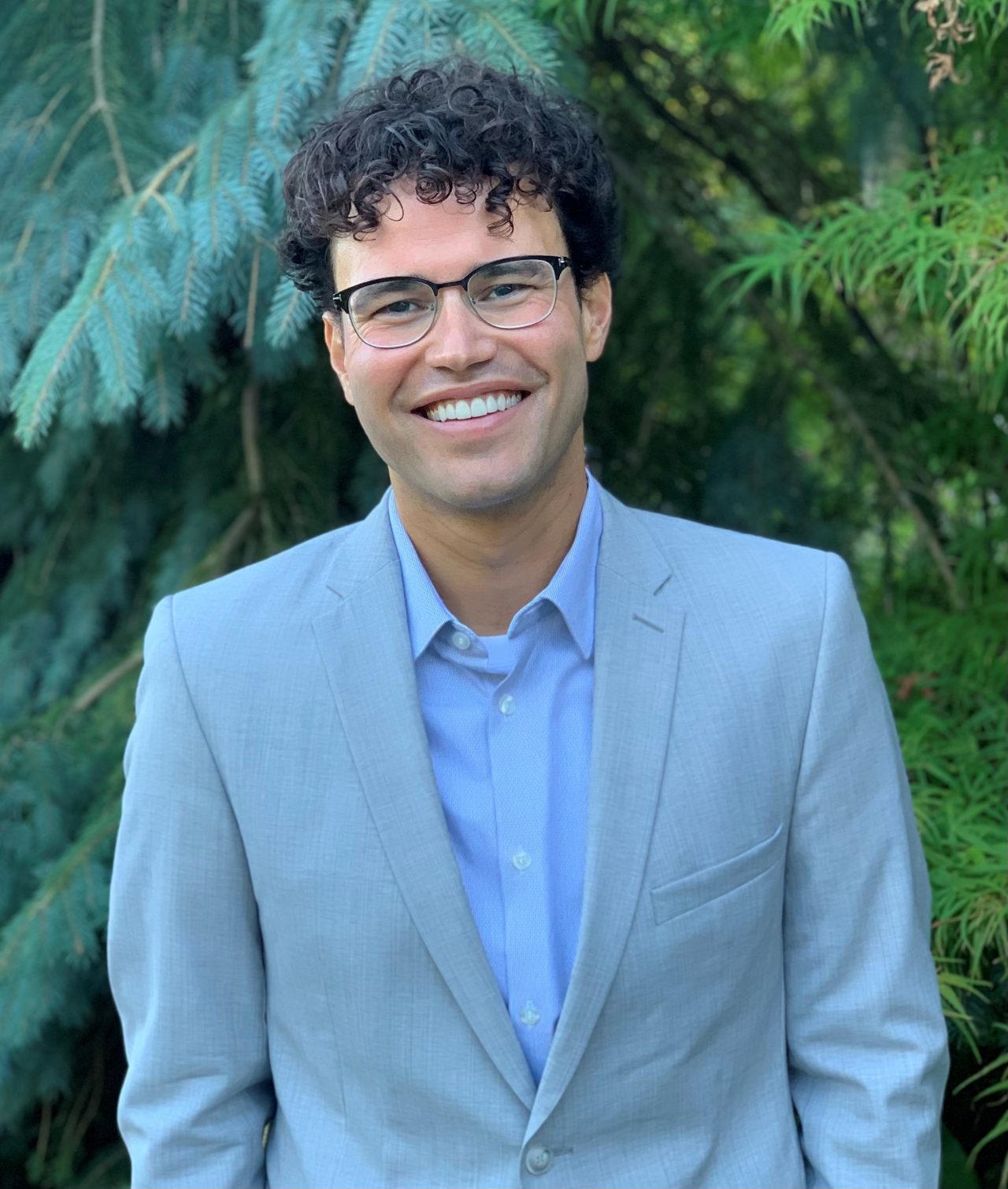 man with brown hair and beard smiling