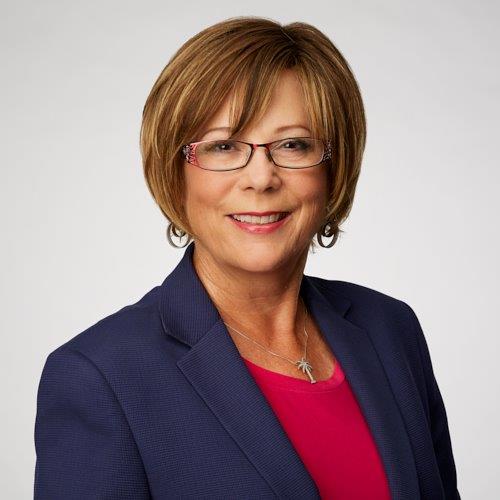woman with short hair smiling